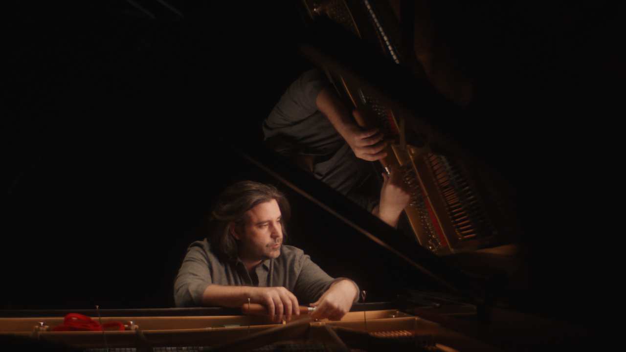 a man sitting at a piano